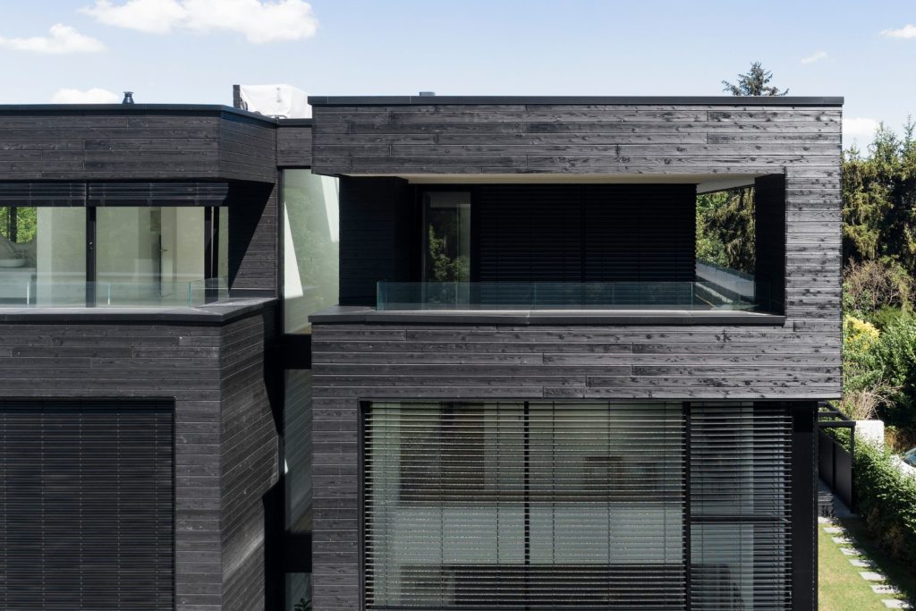 Semidetached house with black facade wood