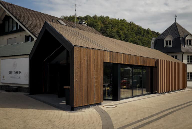 Winery with wooden vinotheque and trees in the background