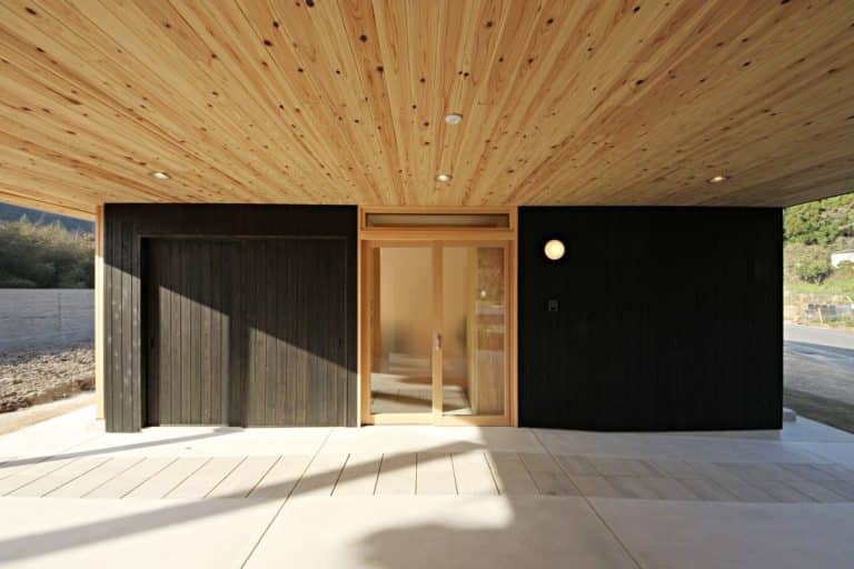 Black wooden wall facade with bright ceiling made of sugi